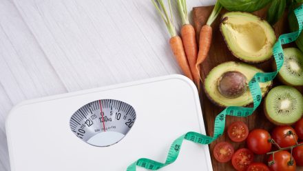 weight loss scale with centimeter. diet concept. healthy food ba